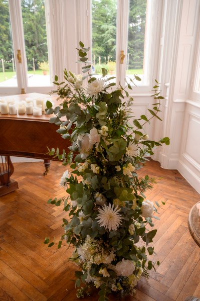 Close up of white flowers roses bouquet candles